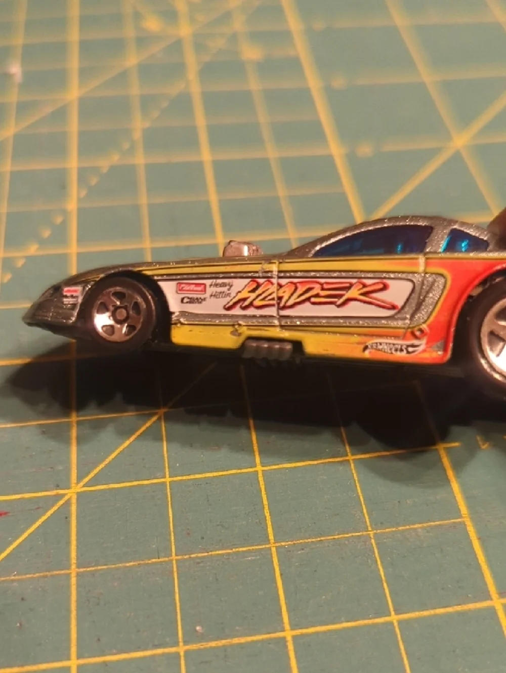 2010 Hot Wheels HLADEK Silver Racing Toy Car with Blue Windows and Red Accents